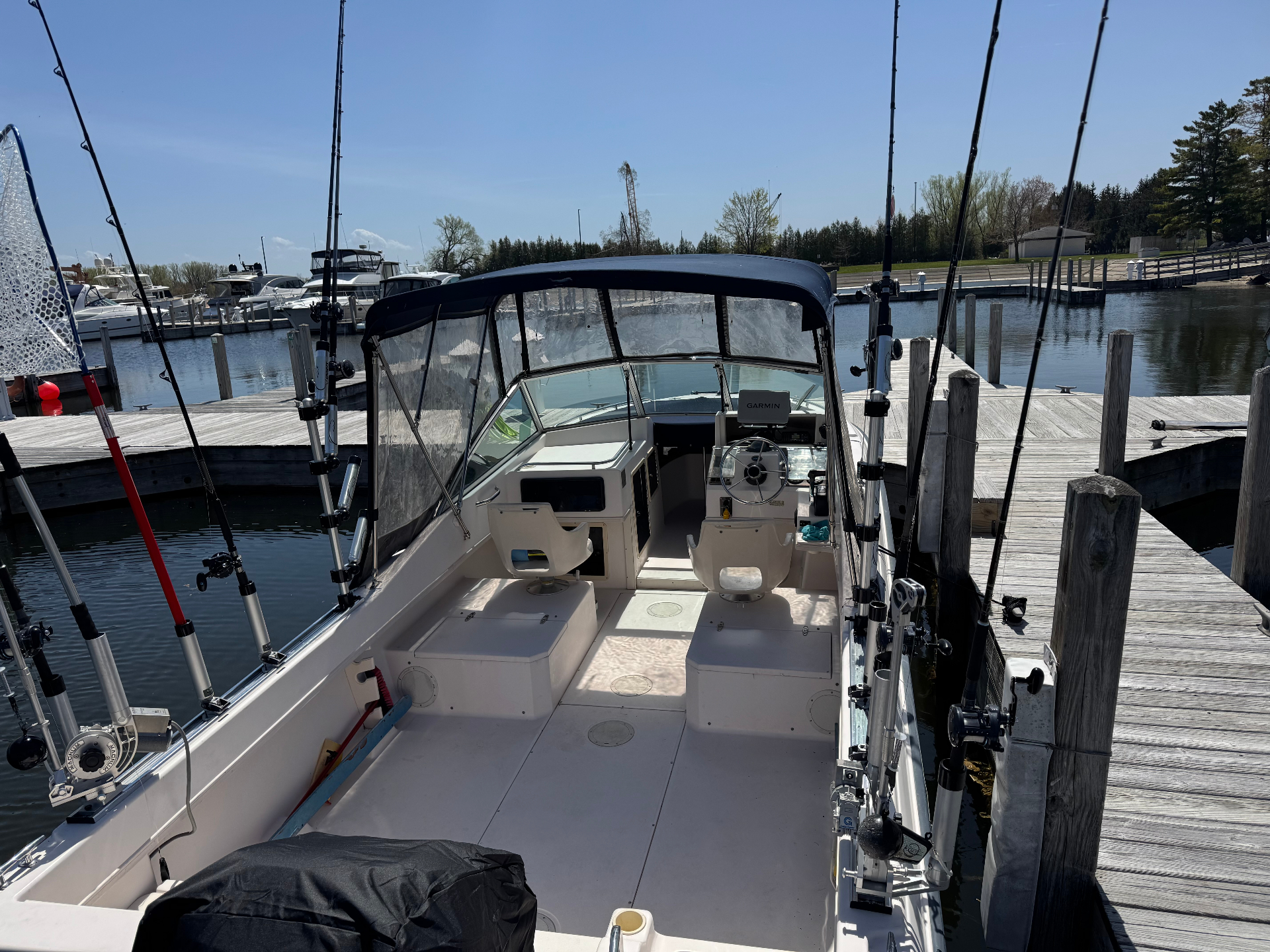 Reel Mafia cockpit with downriggers and fishing gear